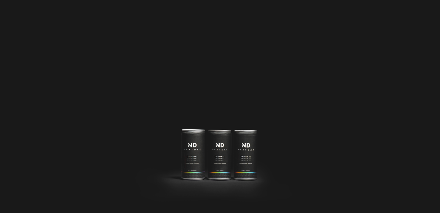A trio of NextDay Original all-natural, FDA-certified hangover recovery drinks on a black background.